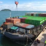kegiatan bongkar muat peti kemas perdana milik PT Pulau Laut Line di Terminal Kijing